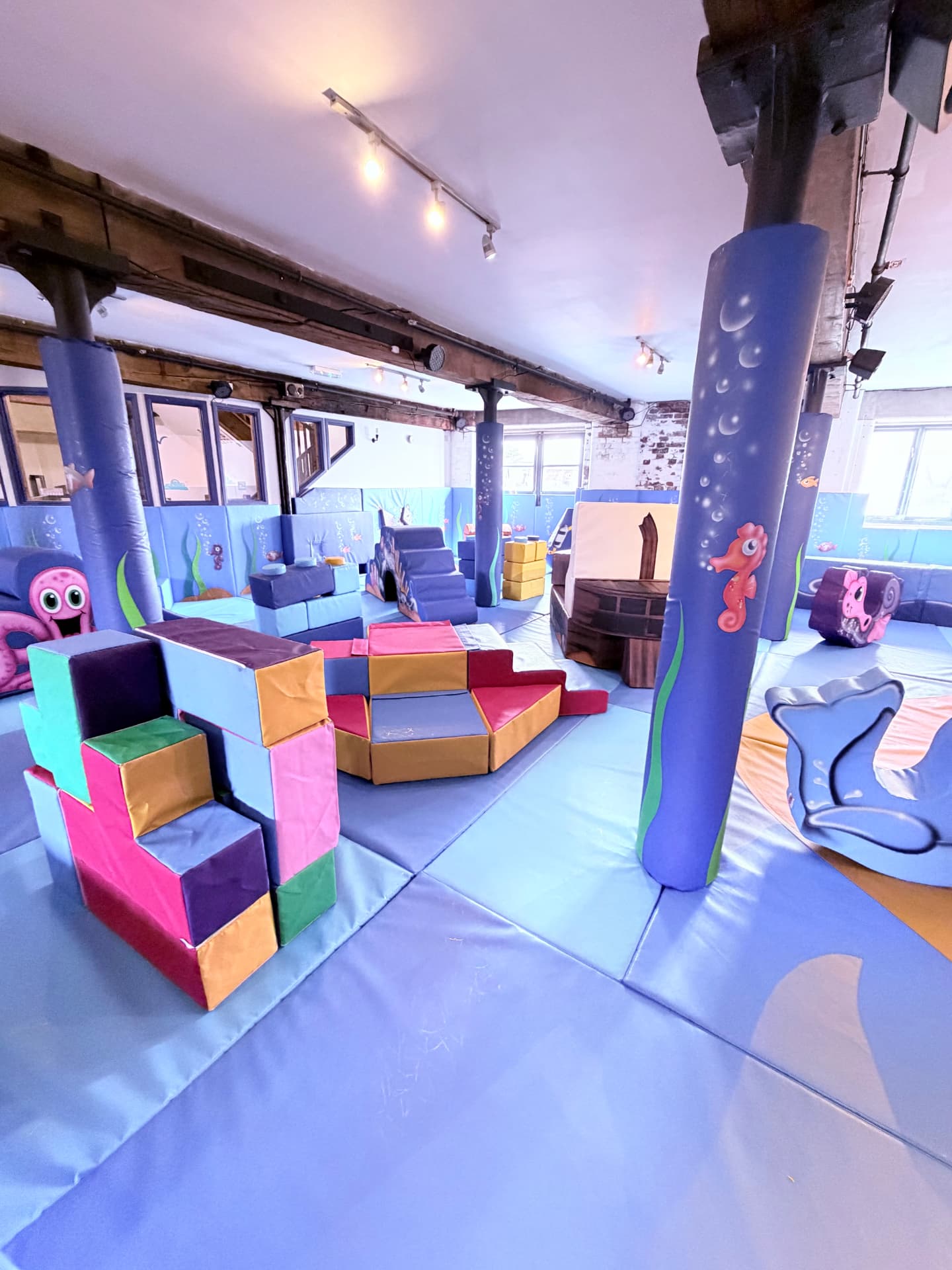 Colourful soft blocks and nautical themed pillars in the Little Harbour Club soft play room in Weymouth